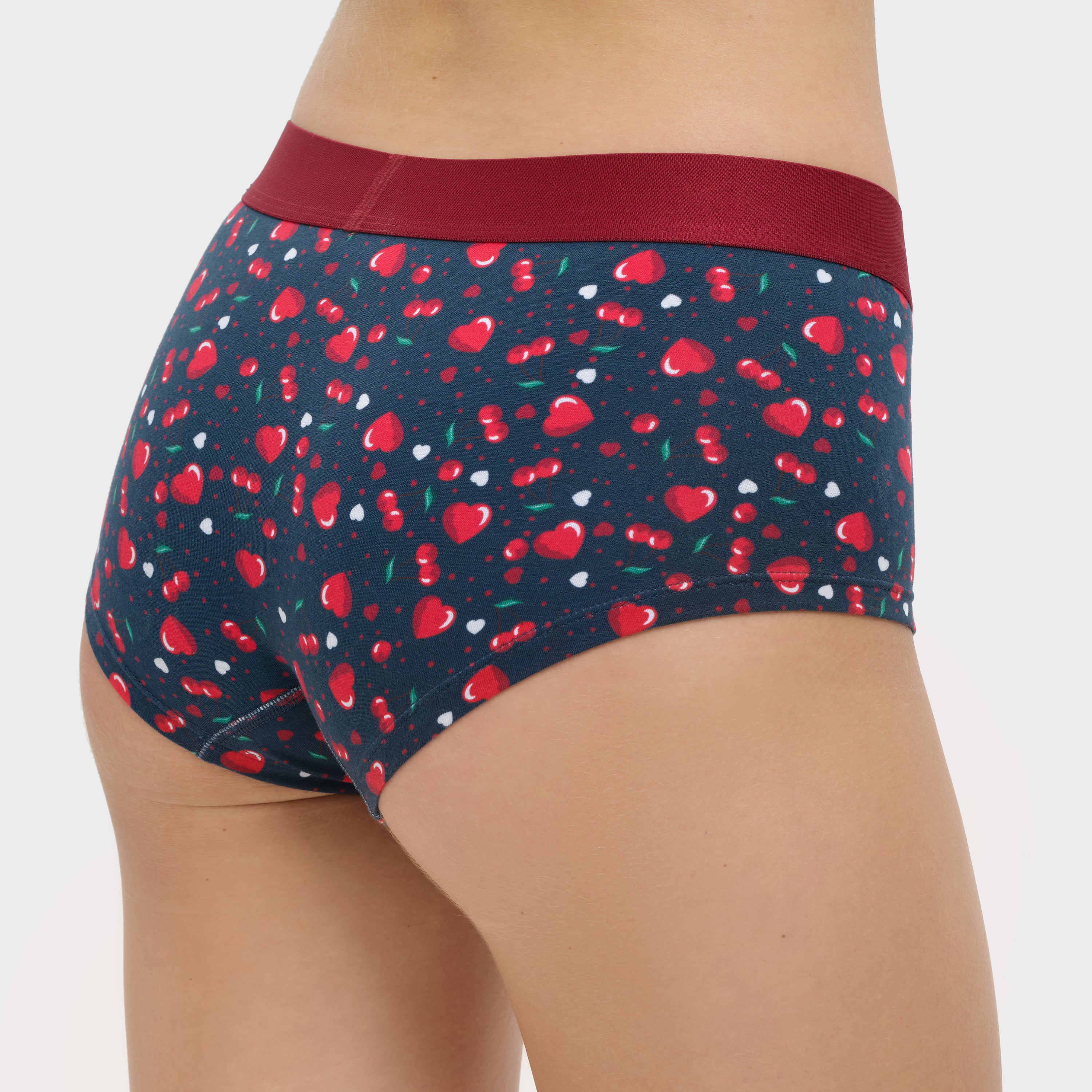Navy underwear with red heart pattern on a white background