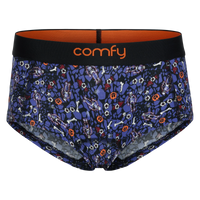 fit:hipster | quantity:1x | A pair of women's hipsters by Comfy featuring a dark blue and black Halloween-themed print with bones, ghosts, and jack-o'-lanterns, a black waistband with orange interior lining, and the brand name 'comfy' in orange on the front.