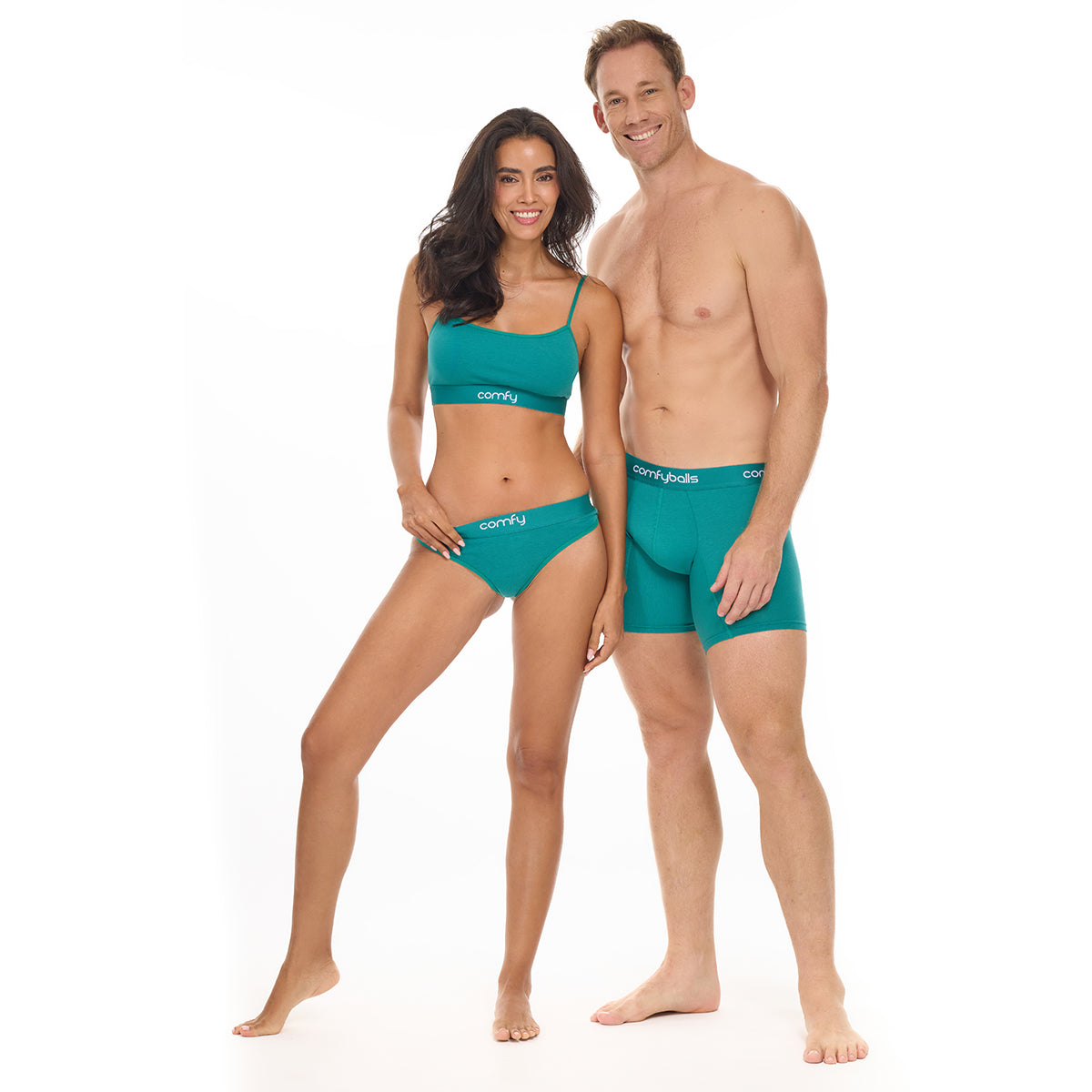 Man and woman wearing matching teal underwear on a white background