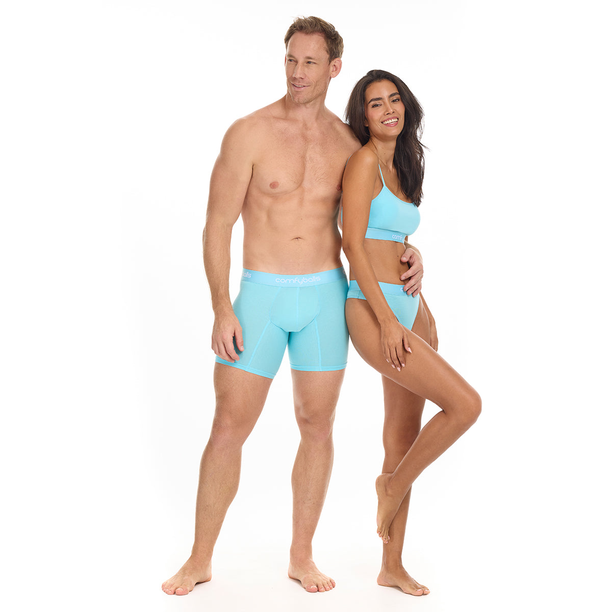 A man and woman wearing matching Comfyballs in the color sky blue.